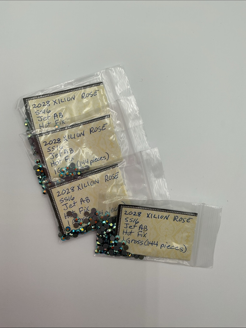 Swarovski • Color: Jet Aurora Borealis, 2028 XILION Rose Hotfix Rhinestones